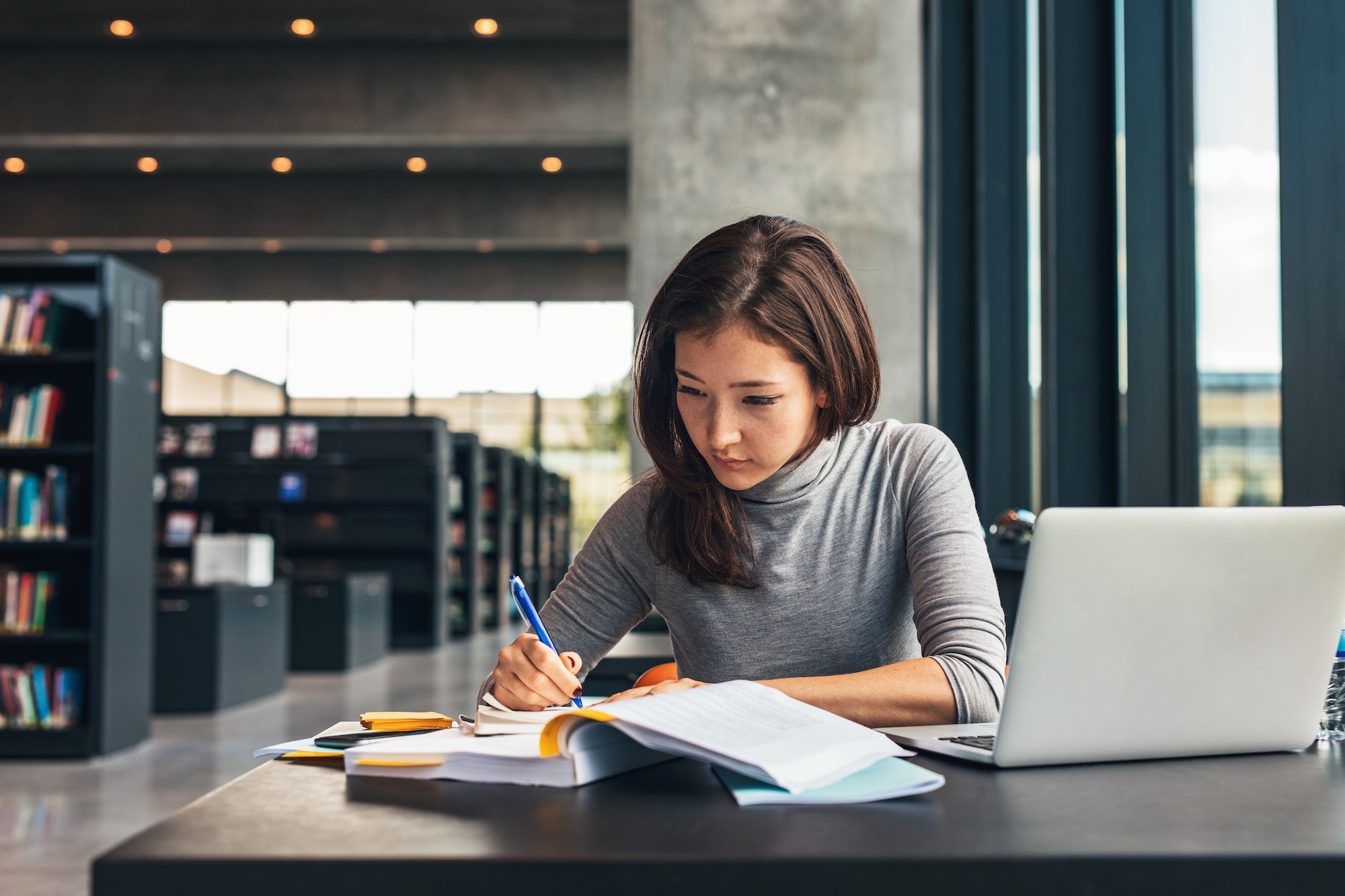 Student studying in a modern library